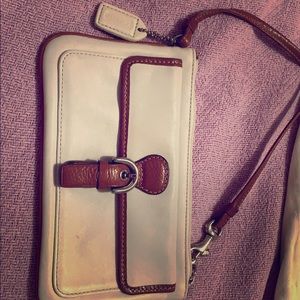 Like new COACH wristlet cream/camel leather.